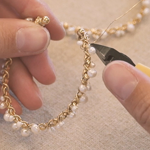 Creating a dance with mother-of-pearl beads